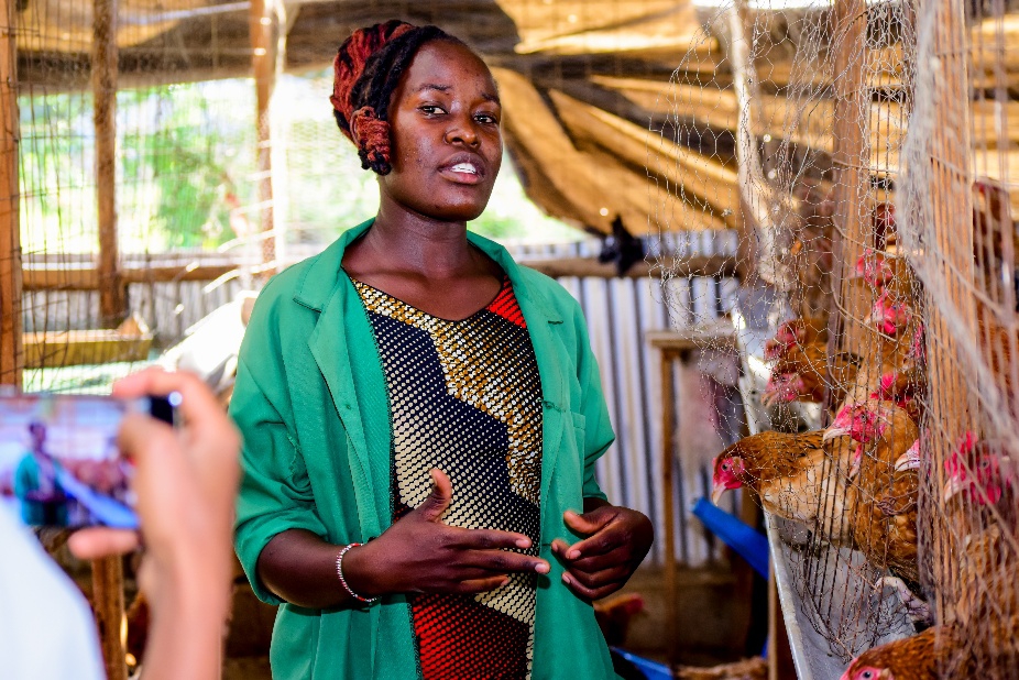 Miriam Ojakol at the Wezesha Agri Eco Hub poultry unit in Alupe, Busia County